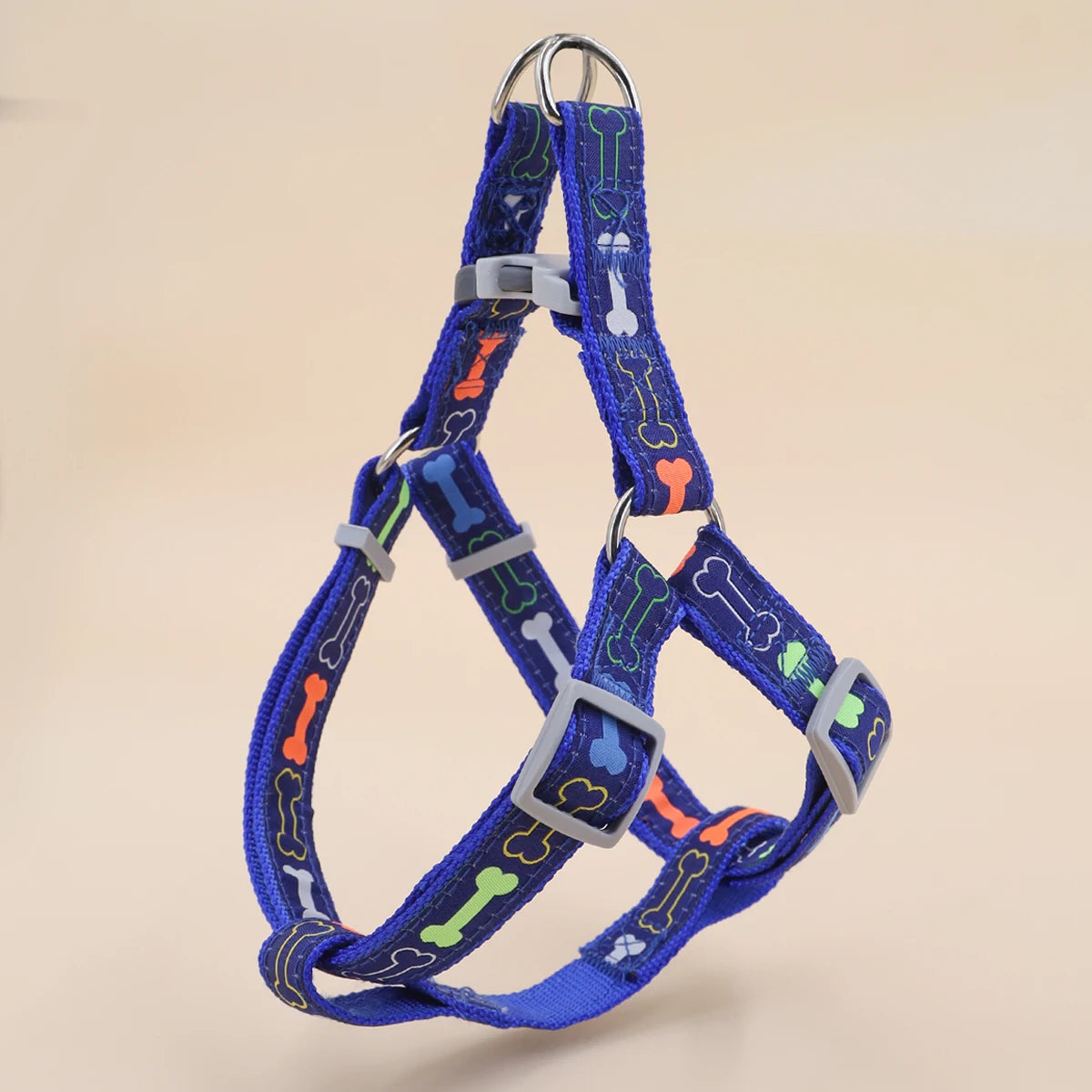 A colorful bone tripod pet dog harness for indoor and outdoor use